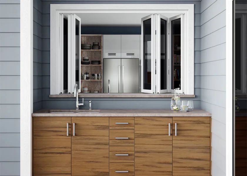 Outdoor kitchen with wood-front cabinetry on a covered patio