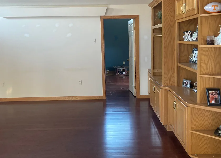 Hardwood flooring through an open-plan living space