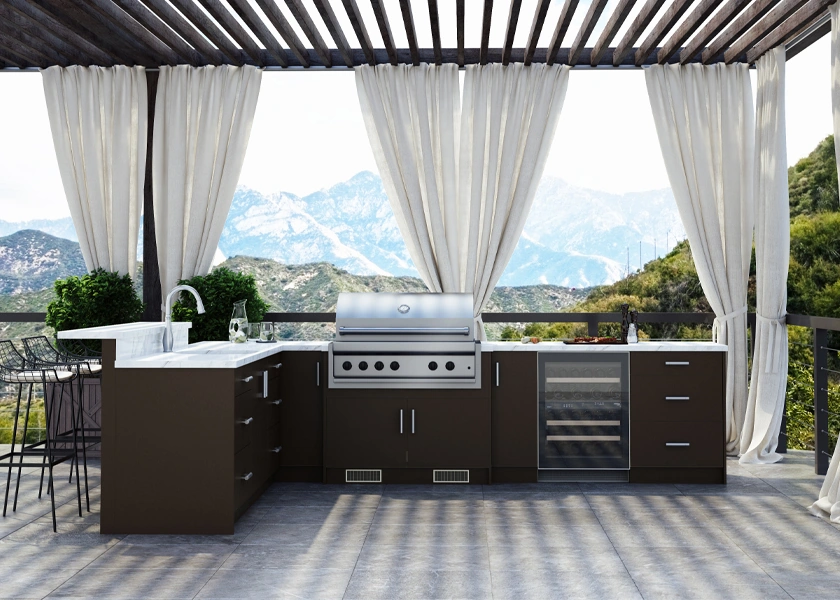 Outdoor kitchen under a pergola with a built-in grill