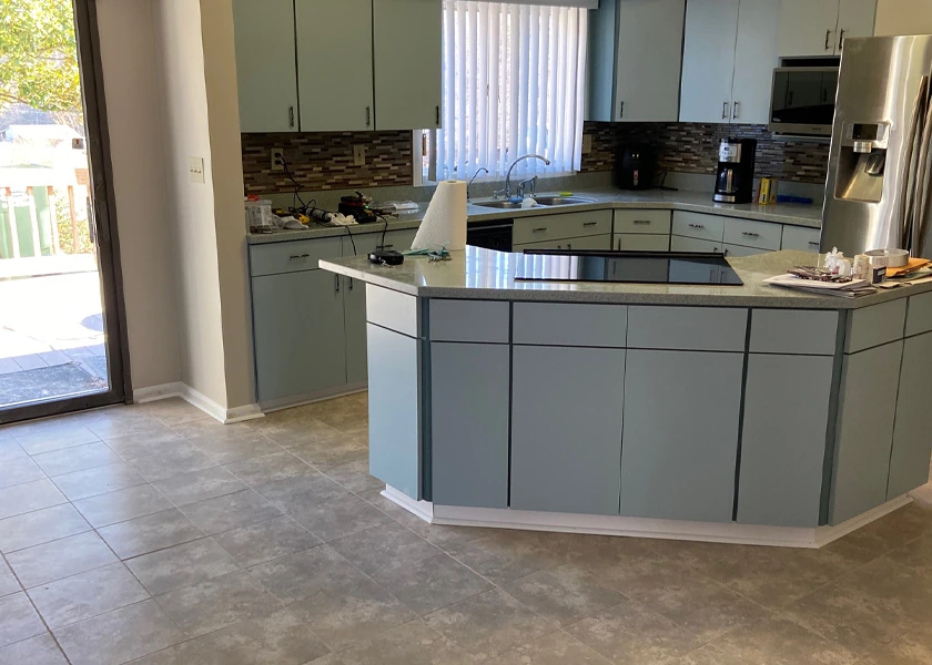 Kitchen remodel with a custom peninsula and stone countertop