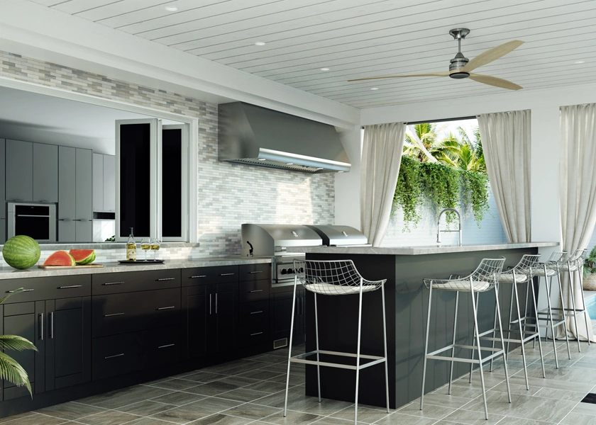Outdoor kitchen with dark cabinetry and a stone countertop