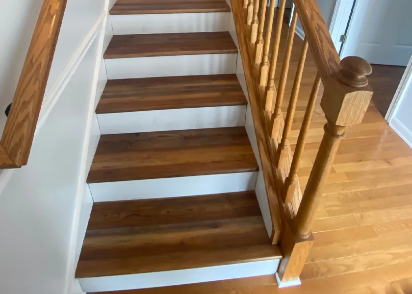 Hardwood staircase with solid treads and railing