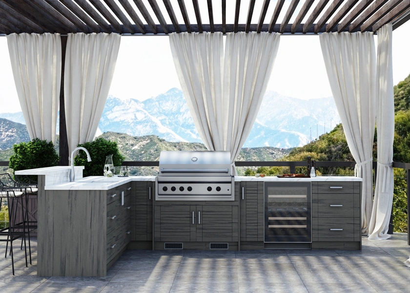 Outdoor kitchen with a grill station and prep sink